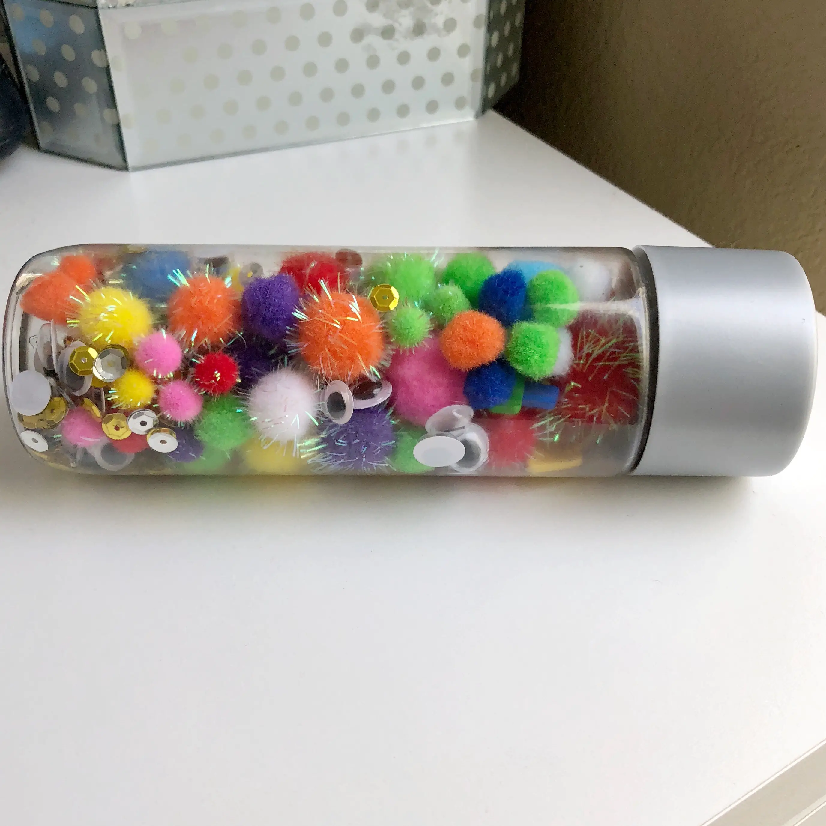 Find out how to make this simple sensory bottle in under five minutes! This bottle contains no liquid inside, so it is super lightweight for your toddler!